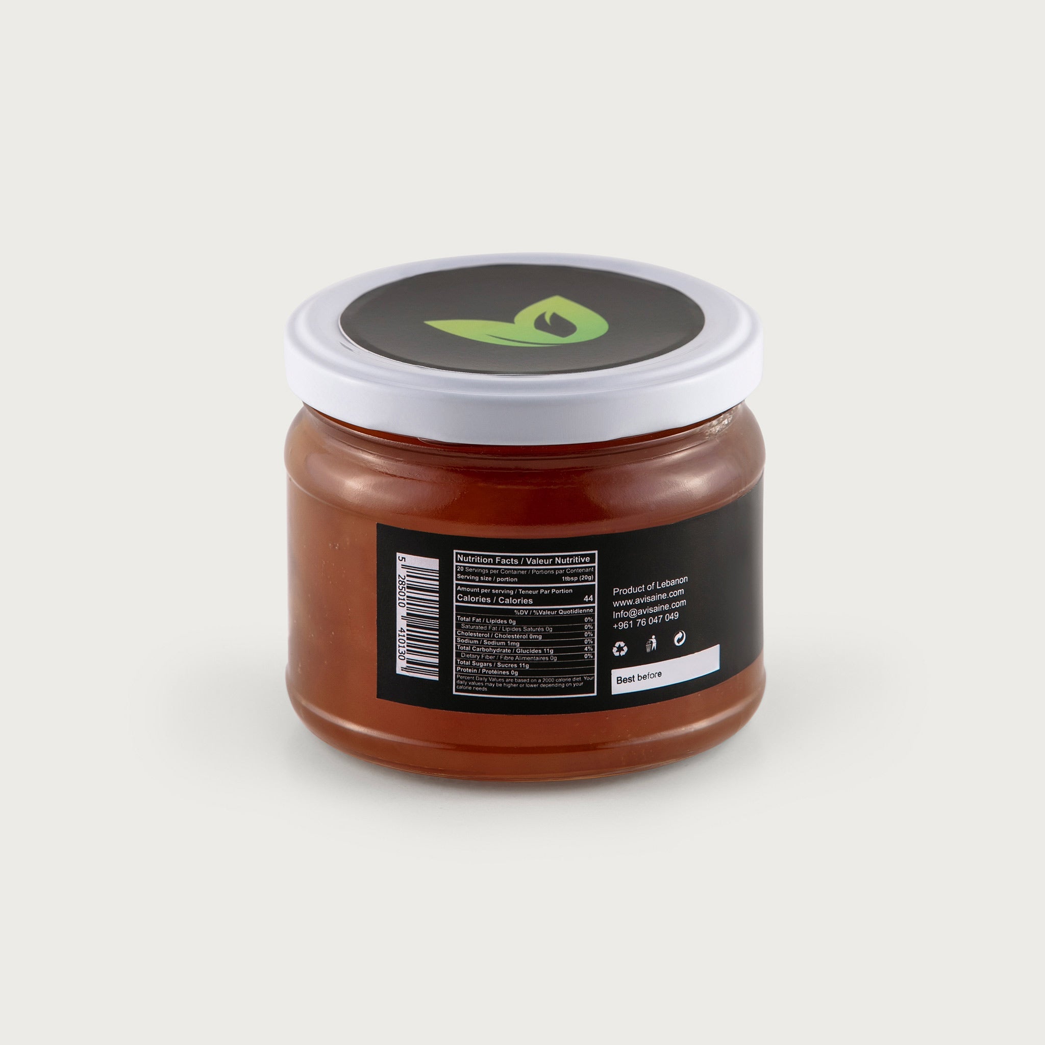 A clear 14 oz jar with a screw top lid shows the rich honey colored apple jam. The label is black with the AviSaine logo, and the lid is white.