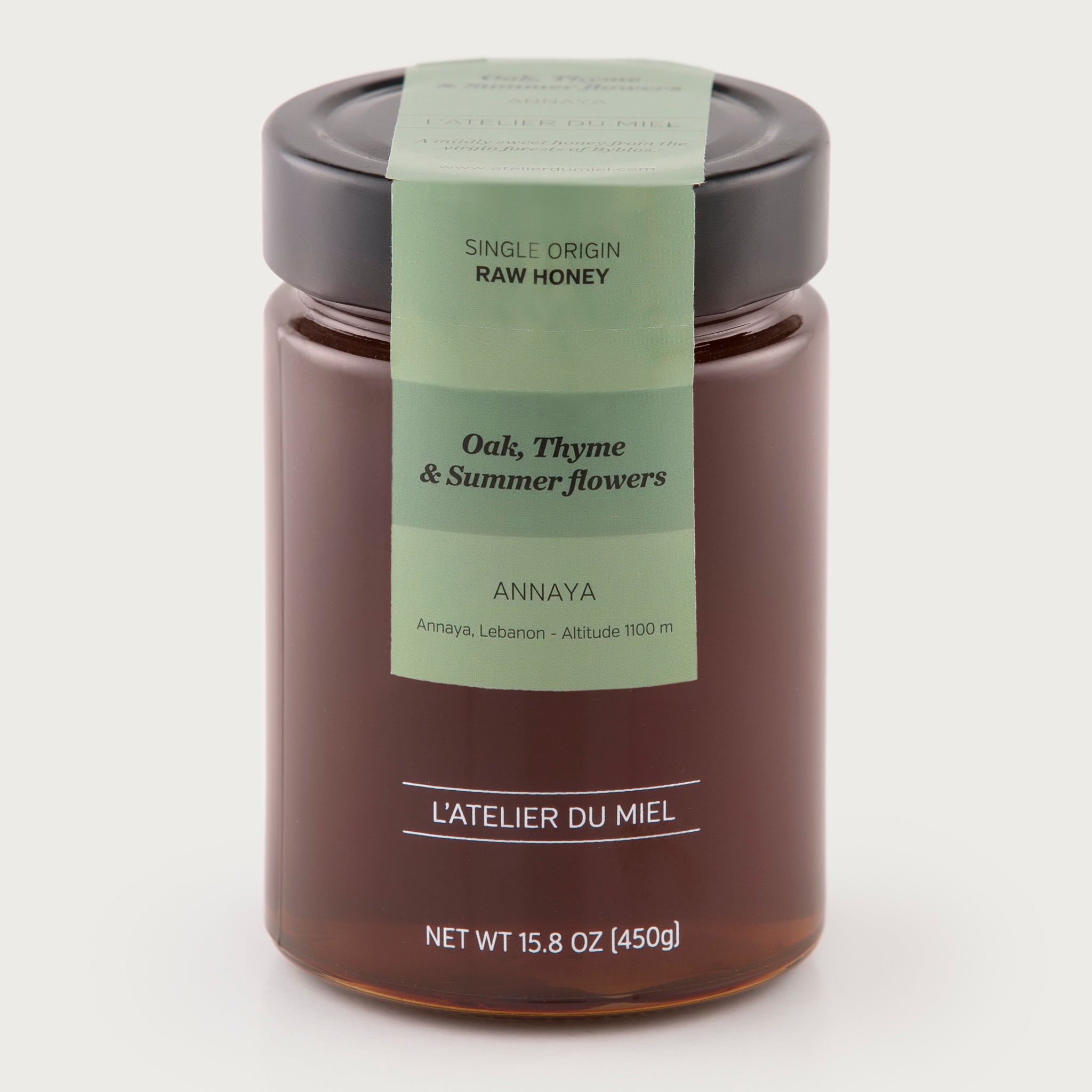 A 15 ounce jar of raw oak honey by L'Atelier du Miel and sold by Za'atar Road