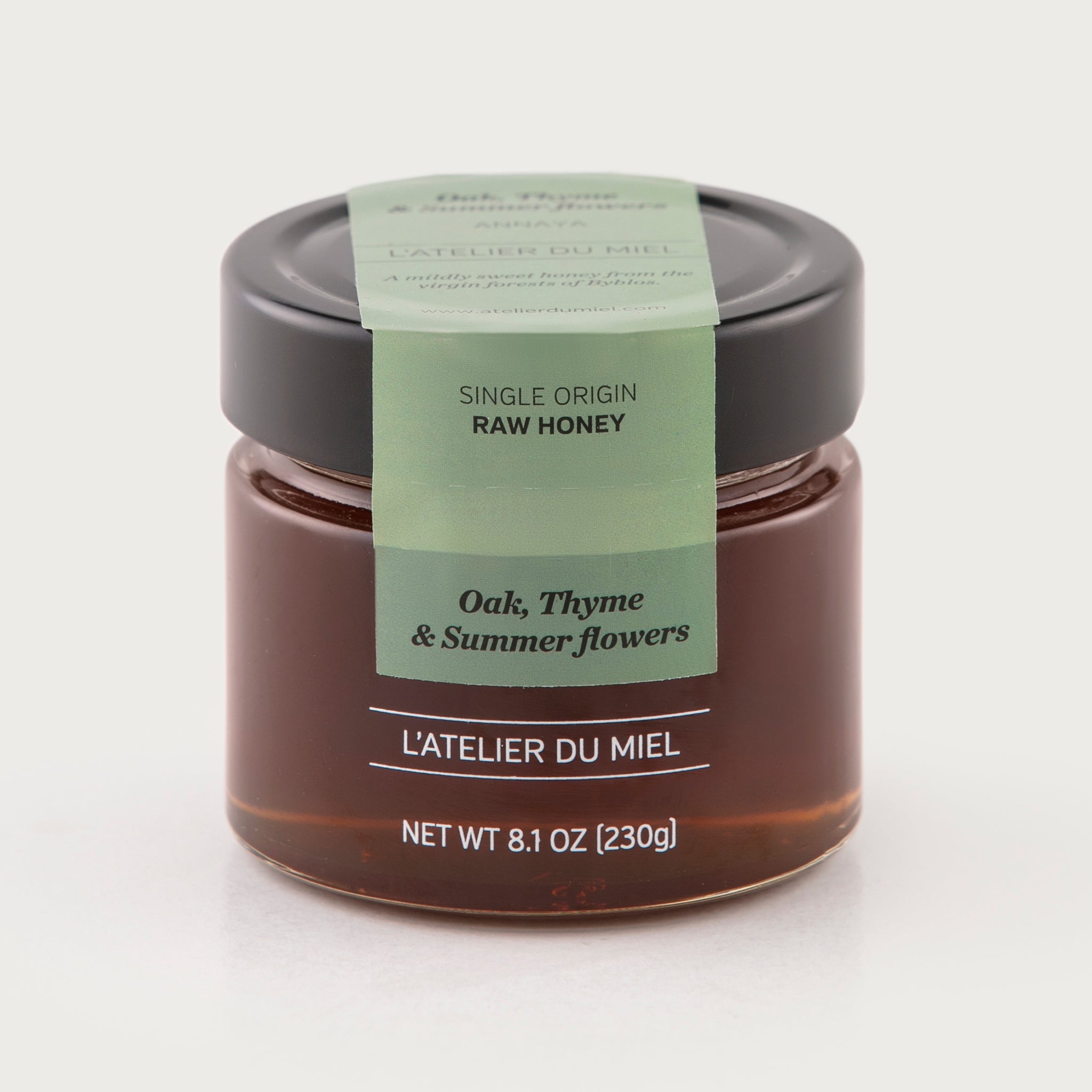 An 8 ounce jar of raw oak honey by L'Atelier du Miel and sold by Za'atar Road